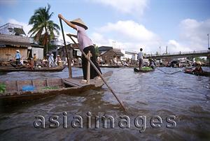 Asia Images Group - Vietnam, Mekong Delta, Phung Hiep, woman paddling boat in floating market.