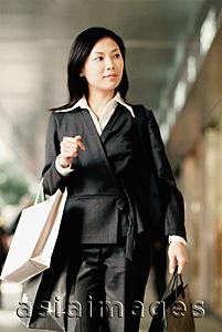 Asia Images Group - Woman carrying shopping bags