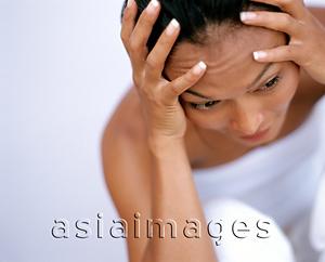 Asia Images Group - Woman holding head in hand, portrait, white background