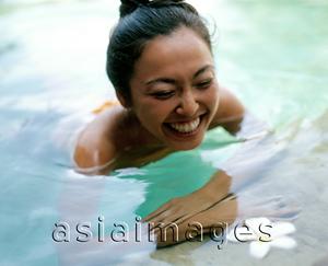 Asia Images Group - Woman in pool smiling