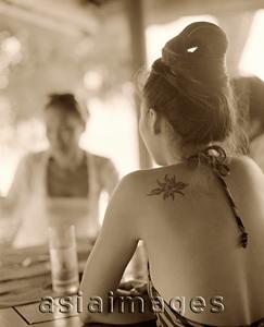 Asia Images Group - Back of woman at outdoor table