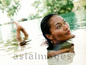 Asia Images Group - Woman in water, looking off camera.