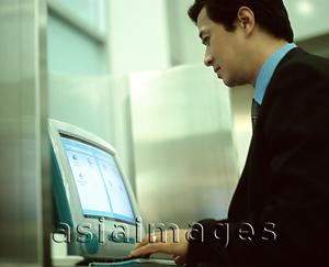 Asia Images Group - Male executive on computer