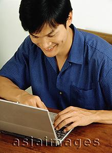 Asia Images Group - Man using laptop