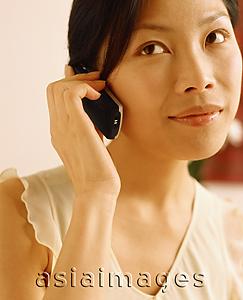 Asia Images Group - Woman using cellular phone