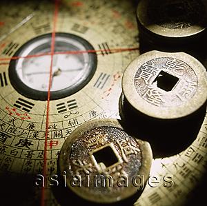 Asia Images Group - Close up of Chinese coins on a Luo Pan (Lo P'an), Feng Shui compass