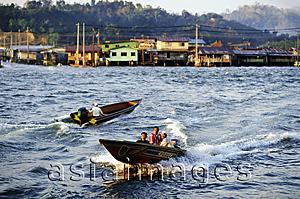 Asia Images Group - Brunei, fast water taxies shuttle between Kampong Ayer and Bandar Seri Begawan.