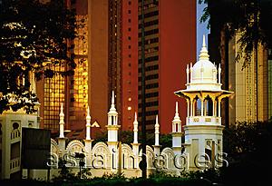 Asia Images Group - Malaysia, Kuala Lumpur, Domes and archways of the Kuala Lumpur Railway Station contrast skyline.