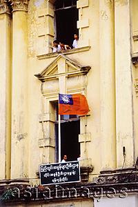 Asia Images Group - Myanmar (Burma), Yangon (Rangoon), Flag in windowsill of old colonial building.