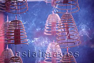 Asia Images Group - Malaysia, Kuala Lumpur, Chinatown, Burning incense coils hanging from ceiling.