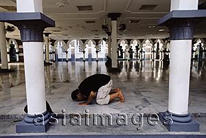 Asia Images Group - Malaysia, Kuala Lumpur, Muslim man praying at National Mosque (Masjid Negara).