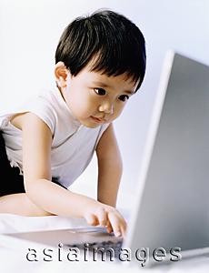 Asia Images Group - Boy, 3 years old, using laptop.