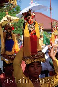 Asia Images Group - Indonesia, Bali, Tanjung Benoa, Women carrying effigies at Melasti ceremony. (grainy)