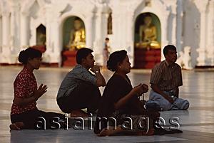 Asia Images Group - Myanmar (Burma), Yangon, Worshippers praying at Shwedagon Paya.