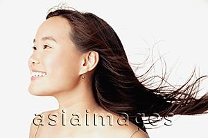 Asia Images Group - Profile of young woman, smiling