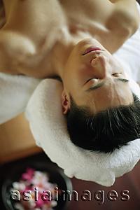 Asia Images Group - Young man lying down on massage table