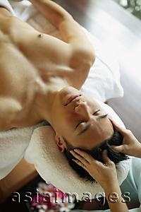Asia Images Group - Young man receiving head massage