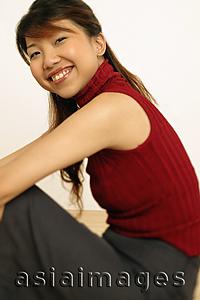 Asia Images Group - Portrait of a young woman, smiling