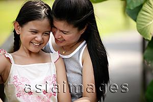 Asia Images Group - Mother hugging daughter, smiling