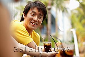 Asia Images Group - Young man smiling, portrait