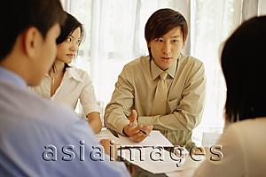 Asia Images Group - Young executives sitting face to face, having a meeting
