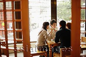 Asia Images Group - Young couples eating at a Chinese restaurant