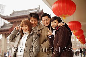 Asia Images Group - Couples posing, looking at camera, making peace signs