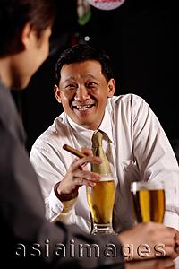 Asia Images Group - Two men drinking beer.