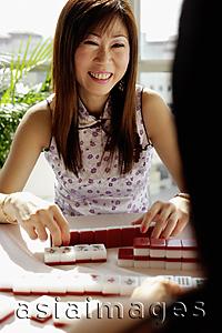 Asia Images Group - Women playing mahjong, face to face