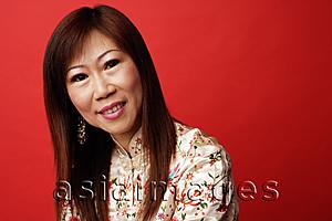 Asia Images Group - Mature woman in cheongsam, portrait
