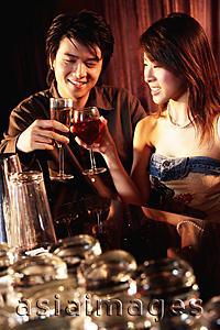 Asia Images Group - Couple having drinks at night club