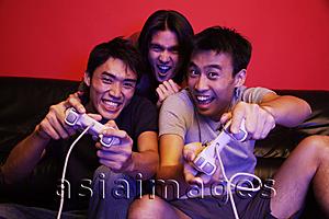 Asia Images Group - Young men playing with video games