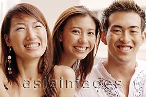 Asia Images Group - Two young women and one young man, looking at camera, portrait