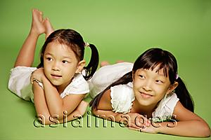 Asia Images Group - Two sisters lying side by side