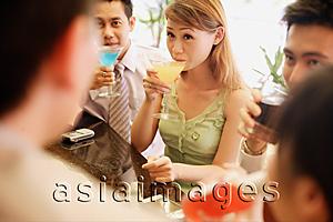 Asia Images Group - Group of young adults drinking at bar