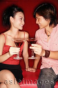 Asia Images Group - Couple toasting with drinks