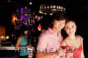 Asia Images Group - Couple with drinks, looking at camera, portrait