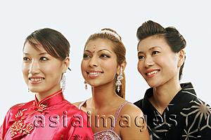 Asia Images Group - Women in traditional costumes, looking away, head shot
