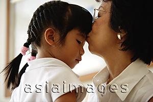 Asia Images Group - Grandmother kissing granddaughter