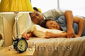 Asia Images Group - Mature couple sleeping in bedroom