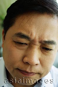 Asia Images Group - Man frowning, headshot