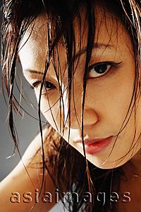 Asia Images Group - Young woman looking at camera, hair wet