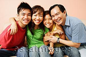 Asia Images Group - Family of four looking at camera, portrait
