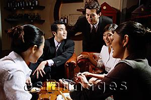 Asia Images Group - Executives sitting together having drinks