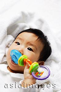 Asia Images Group - Infant boy biting toy