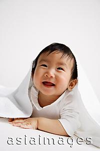 Asia Images Group - Baby boy peeking out from under blanket