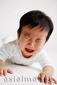 Asia Images Group - Baby boy lying on front, crying