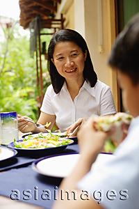 Asia Images Group - Woman having salad, smiling
