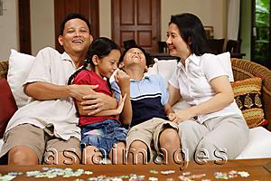 Asia Images Group -  Family in living room, bonding, portrait