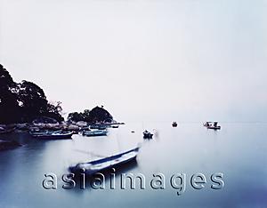 Asia Images Group - Fishing boats at sundown